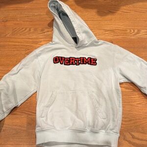 Overtime sweat shirt. Pale teal or light blue color. Hoodie